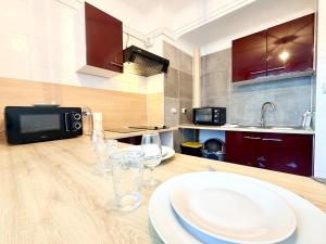 a kitchen with a table with plates on it at La coloc suédoise in Calais