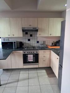 a kitchen with a stove top oven in a kitchen at Mapungubwe hotel unit 525 in Johannesburg