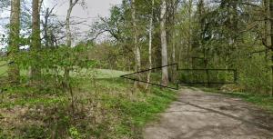 a path in a wooded area with a black box at Kousek země pro tvůj stan in Cheb