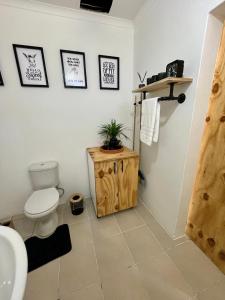 a bathroom with a toilet and a sink at Angel's Cottage Unit 1 in Paarl +6 photos