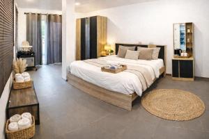a bedroom with a large bed in a room at Villa Lilly in Rawai Beach