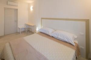 Postel nebo postele na pokoji v ubytování Affittacamere Margherita