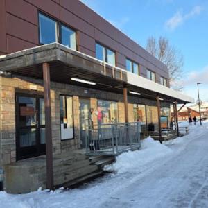 a building with snow in front of it at Lofoten Premium Suites in Leknes
