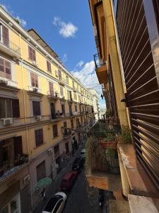 a view from a window of a street with buildings at Da Alfred in Naples