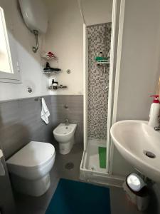 a small bathroom with a toilet and a sink at Da Alfred in Naples +33 photos