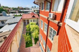 an apartment balcony with a view of a city at Light Hostel by TripLE in Yakkasaray