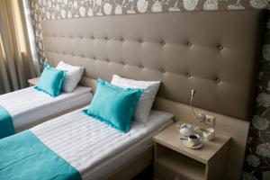 Кровать или кровати в номере Hotel Versailles