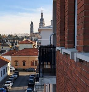 a view of a city from the balcony of a building at Sweet home in Novara