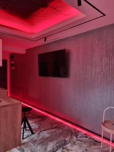 a room with a red led lighting on a wall at ApuLux Apartments in Alba Iulia