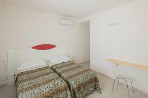 Postel nebo postele na pokoji v ubytování Affittacamere Margherita