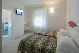 Postel nebo postele na pokoji v ubytování Affittacamere Margherita
