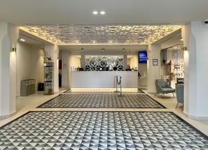 a lobby of a store with a counter at Sahara Sunset in Benalmádena +36 photos