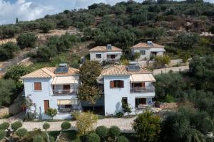 an aerial view of a house on a hill at Mary's Panorama Houses in Gialova