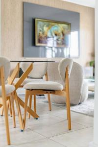 a table and chairs in a living room at 2 Bedroom 2 Bathroom Executive Suite in Midrand
