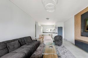 a living room with a couch and a table at 2 Bedroom 2 Bathroom Executive Suite in Midrand
