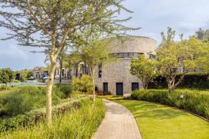 a brick building with a dome on the side of it at 2 Bedroom 2 Bathroom Executive Suite in Midrand