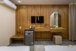 a hotel room with a tv and a mirror at Solis Pyramids View Hotel in Cairo