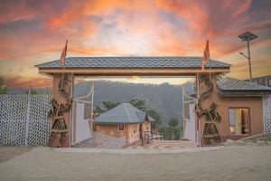 a painting of a pavilion with a house at A Kasauli Ggaon by Echor in Kasauli