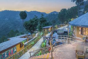 an amusement park with a water slide and a train at A Kasauli Ggaon by Echor in Kasauli +63 photos