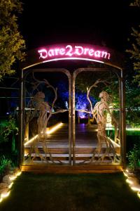 a sign that says dance dream at night at Forum Homini Boutique Hotel in Krugersdorp
