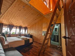 a bedroom with a bed and a ladder in a room at Beyond Baari Inn in Darjeeling +36 photos