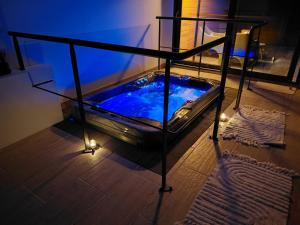a jacuzzi tub with lights in a room at Cozyhouse in Touquet Berthe