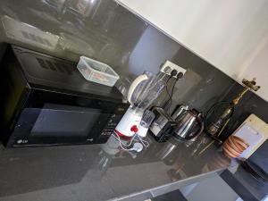 a kitchen counter with a blender and other kitchen items at Mango Tree Weligama in Weligama +57 photos