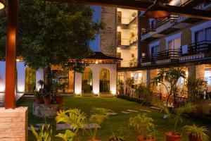 a courtyard of a building with plants and lights at Bodhi Suite Boutique Hotel & Wellness in Pokhara