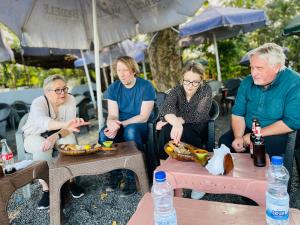 a group of people sitting around a table at Bete Selam in Bahir Dar