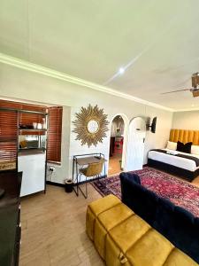 a large living room with a bed and a couch at CHERRY NEST at Madeliefie in Welkom