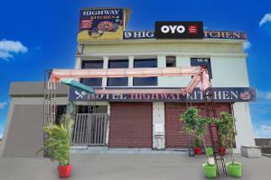 a building with a sign on the side of it at Hotel O Highway Kitchen in Bara Khera +22 photos