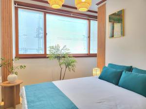 a bedroom with a bed and two windows at 대구 K Stay in Daegu +32 photos