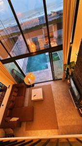 an aerial view of a living room with a large window at Villa Bella in Atakum +3 photos