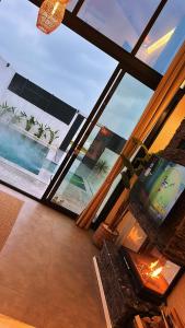 a view of a living room with a large window at Villa Bella in Atakum