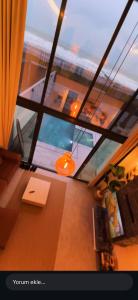 a room with a window with a desk and a laptop at Villa Bella in Atakum