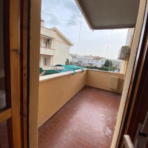 an empty balcony with a view of a building at A Casa Di Mina in Civitavecchia