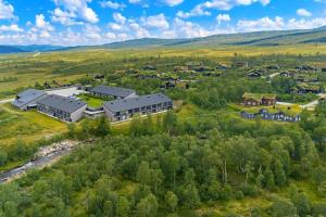 an aerial view of a large home in the hills at Leilighet på Hovden in Bykle