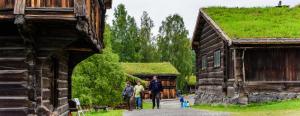 a group of people standing in front of a building at Cosy Cottage Vollheim in Lillehammer