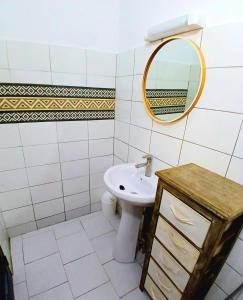 a bathroom with a sink and a mirror at Cozy Studio with Private Jacuzzi and Pool! in Saly Portudal +5 photos