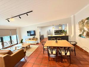 a living room with a table and a couch at Die Stal in Wellington