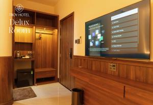 a large flat screen tv in a hotel room at TROY HOTEL - Bà Rịa in Ấp Long Kiên I