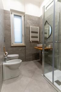 a bathroom with a toilet and a sink at Nena Sweet Home in Palermo +17 photos