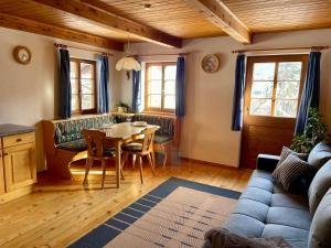 a living room with a table and a couch at Mantlerhof in Virgen