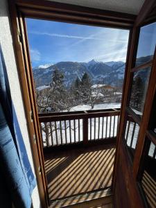 a view of the mountains from a balcony at Mantlerhof in Virgen +14 photos