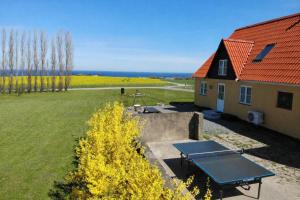 an overhead view of a house with a picnic table at Solhjem Bornholm - Top Rated Sea View Stay in Gudhjem