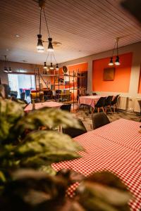 a dining room with tables and chairs and tablesktop at Hótel Valaskjálf in Egilsstaðir