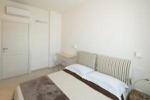 Postel nebo postele na pokoji v ubytování Affittacamere Margherita