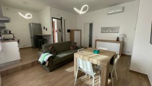 a living room with a couch and a table at La Contessa Home in Avellino