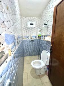 a bathroom with a toilet and a sink at Binic guest house in Taghazout