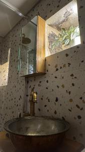 a bathroom with a sink and a mirror at Sadarmis Houses in Leonidio +59 photos